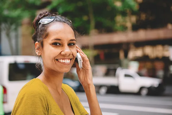 Woman smiling on her mobile phone